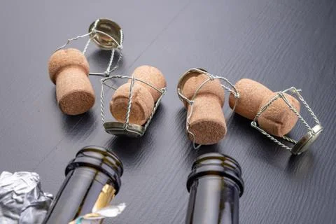 Closed bottle of champagne on the kitchen table. Opening a new bottle of nobl Stock Photos