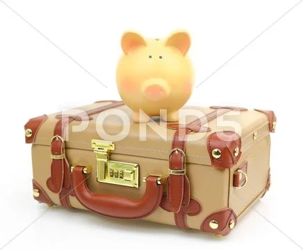Closed brown suitcase with piggy bank on top of it Stock Photos
