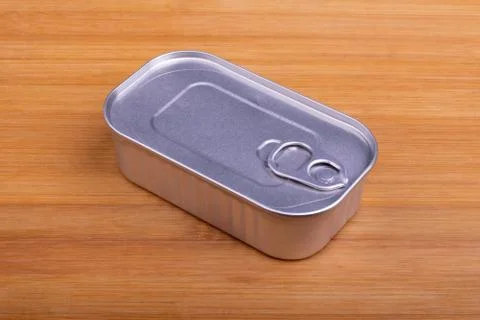 Closed can without marking on cutting board Stock Photos