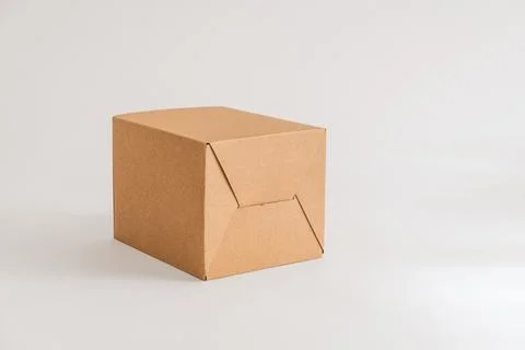 Closed cardboard box on white background Stock Photos
