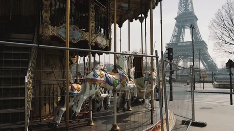 Closed carousel and deserted Eiffel tower during coronavirus lockdown in Paris Stock Footage 126753198