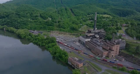 Closed Coal Power Facility Near River Crossing and Rail Network Stock Footage 337225042