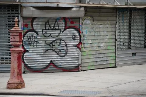 Closed corner store with graffti Stock Photos