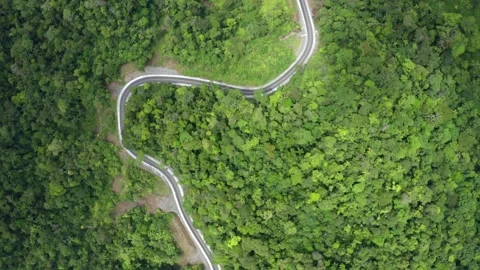 A closed curve in the road winding through the hills of the Andes in Ecuador Stock Footage 165845594