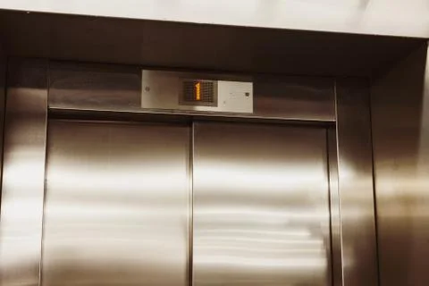 Closed door of the lift. Elevator on the first floor. Stock Photos
