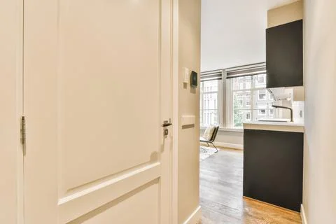 Closed doors in light corridor in flat Stock Photos
