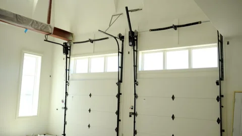 Closed double garage Doors. Inside in garage shot footage. Move camera Stock Footage 310629114