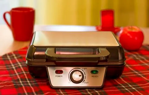 Closed Electronic waffle-iron. Sample model for a kitchen appliance. View of Stock Photos
