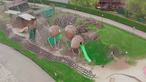 Closed empty children's colourful outside playground. pine cone slides. 스톡 동영상 153423628