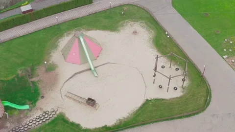 Closed empty children's colourful outside playground. pine cone slides. Video stock 153424580