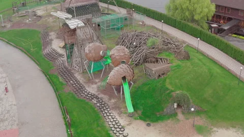 Closed empty children's colourful outside playground. pine cone slides. Stock Footage 153424716