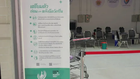 Closed &amp; Empty, Thailand Indoor Covid Vaccination Clinic Sign At Shopping Mall Stock Footage 256049530