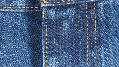 Closed fly on a pair of jeans, tracking. Close up top view. Slider shot Stock Footage 121341642