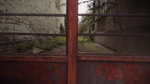 Closed gate, guards the empty backyard Stock Footage 68521673