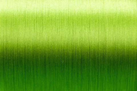 Closed up of green color of thread textured background (Focus at center of .. Stock Illustration