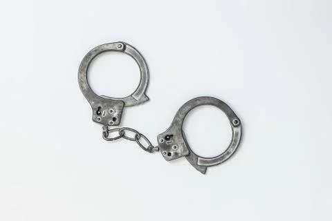 Closed handcuffs on white background isolate Stock Photos