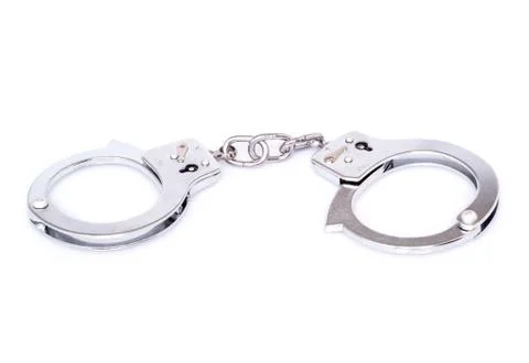 Closed handcuffs on white background Stock Photos