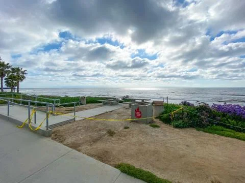 Closed La Jolla Beach with informative signage during COVID-19 pandemic. Stock Photos
