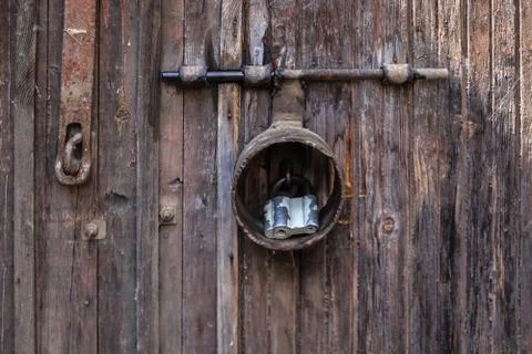 Closed large old door with a rusty lock close-up. 写真素材