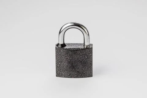 Closed lock on a gray background Stock Photos