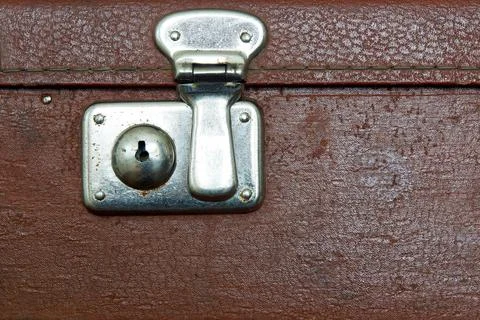 Closed lock of an old suitcase dark brown color Foto stock