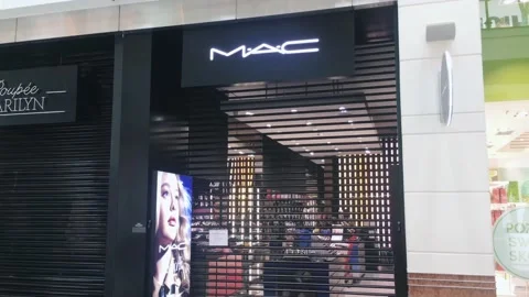Closed Mac brand store in a shopping mall during coronavirus covid-19 pandemic Stock Footage 151378544