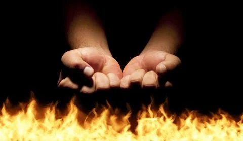 Closed man hands over the hell flames Stock Photos
