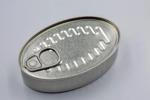 Closed metal tin can with pull tab lid closeup. Stock Photos