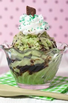Closed up mint chocolate chip ice cream with whipped cream and syrup Stock Photos