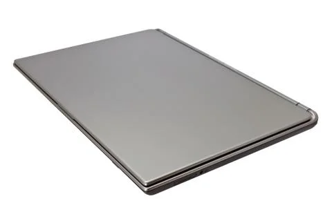 Closed notebook computer on white background Stock Photos
