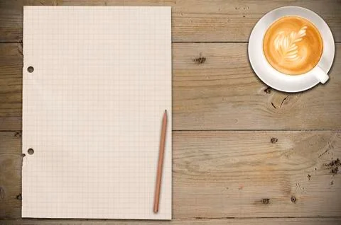 Closed notebook with cup of coffee Stock Photos