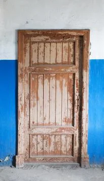 The closed old decayed door Stock Photos