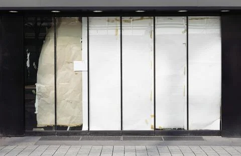 Closed or empty shop or store storefront with blocked windows Stock Photos
