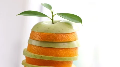 Closed Up Orange and green apple Slices Fruits Rotating : 4k Stock Footage 97368456