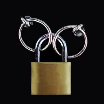 Closed padlock on black background Stock Photos