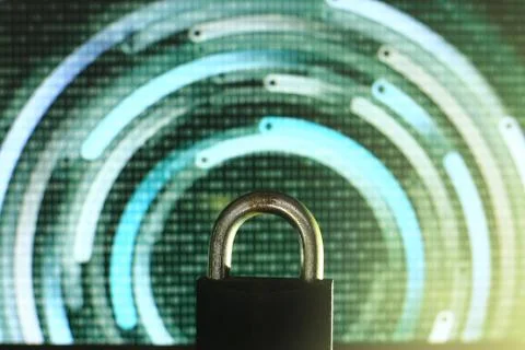 Closed padlock in front of green matrix and circular lines background. cyber Stock Photos