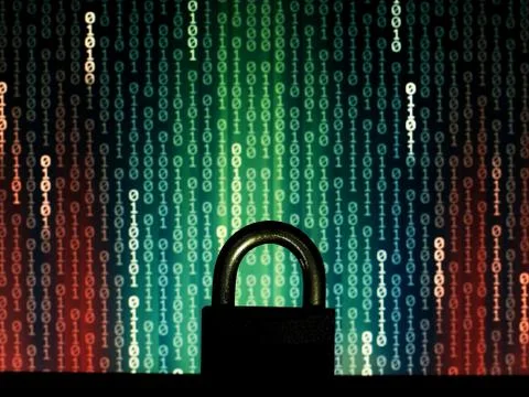 Closed padlock in front of matrix style computer language binary data code. b Stock Illustration