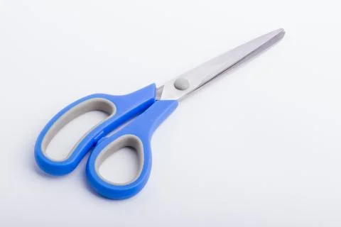 A closed pair of scissors with a blue grip Stock Photos