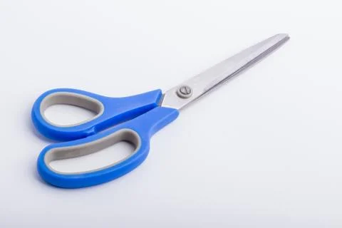 A closed pair of scissors with a blue grip Stock Photos
