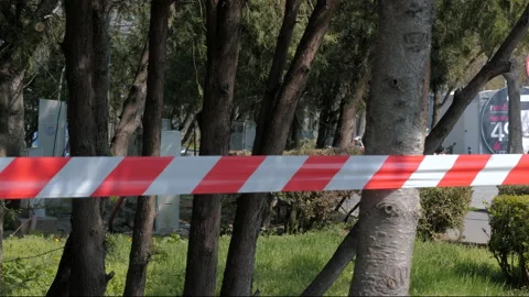 Closed Park with Caution Tape due to Coronavirus outbreak, Quarantined City. Stock Footage 132279227