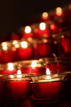 Closed Up Picture of Red Candles that is Lit Arranged Neatly Stock Photos