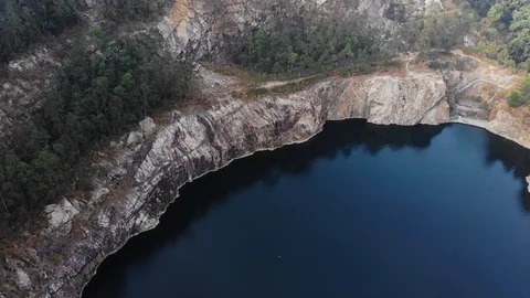 Closed pit Black Lake, around the big cliffs and cliffs. Stock Footage 102541187