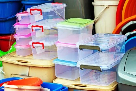 Closed plastic boxes stack on a market place outdoors Stockfoto's