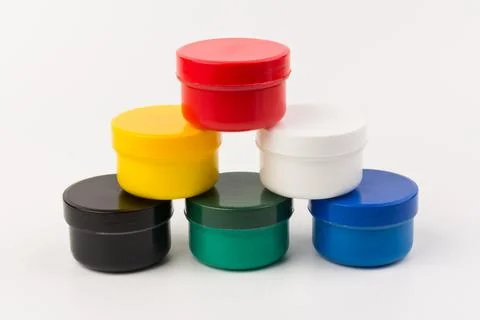 Closed plastic jars with paint of different colors for children's creativity  스톡 사진