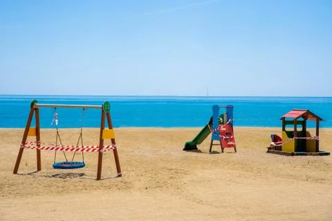 Closed playground on a beach due to COVID-19 pandemic. Stock Photos