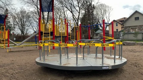 Closed Playground Roundabout Spinning Wheel Toy, COVID-19 Lockdown Pandemic Stock-Footage 128534926