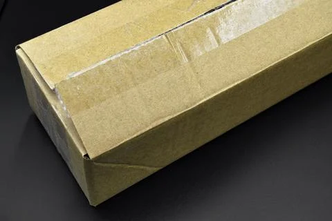 Closed rectangular cardboard box with corrugated cardboard lid isolated on wh Foto stock