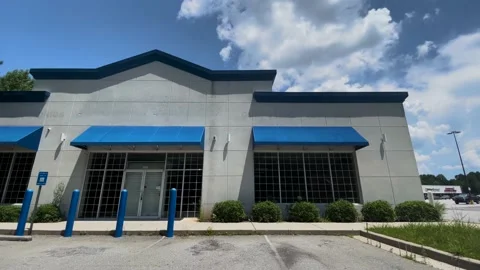 Closed retail store location  blue awnings panel style abandoned empty lease  Stock Footage 201382075