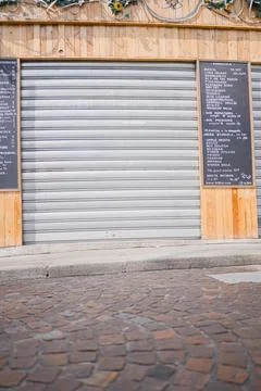 Closed Roll Shutter Dor of a Bar Shop on the Street Stock Photos