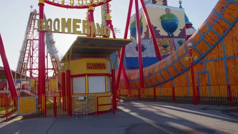 Closed roller coaster ride in amusement park Stock Footage 231054703